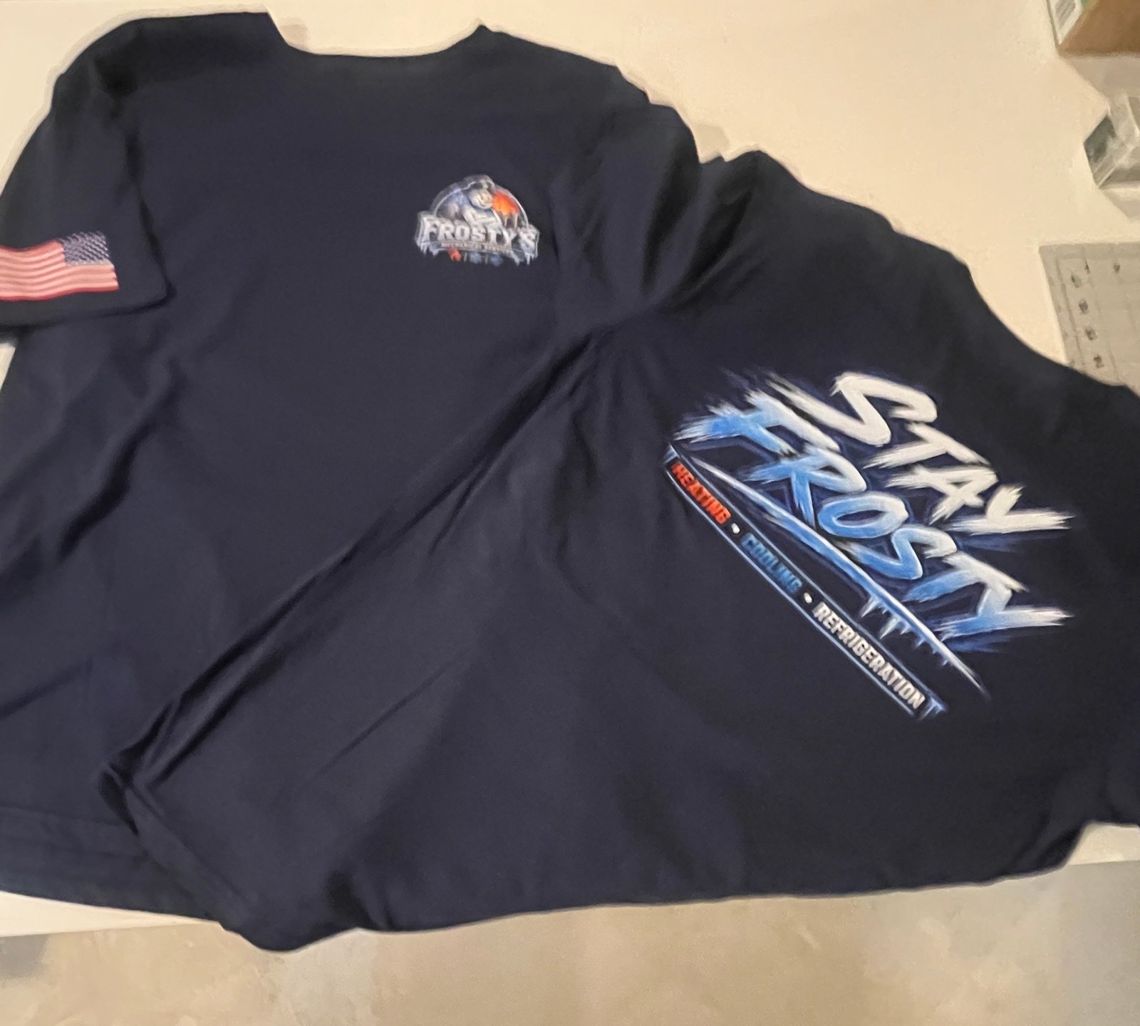 Custom printed Frosty’s business shirts made by Needle & Spark