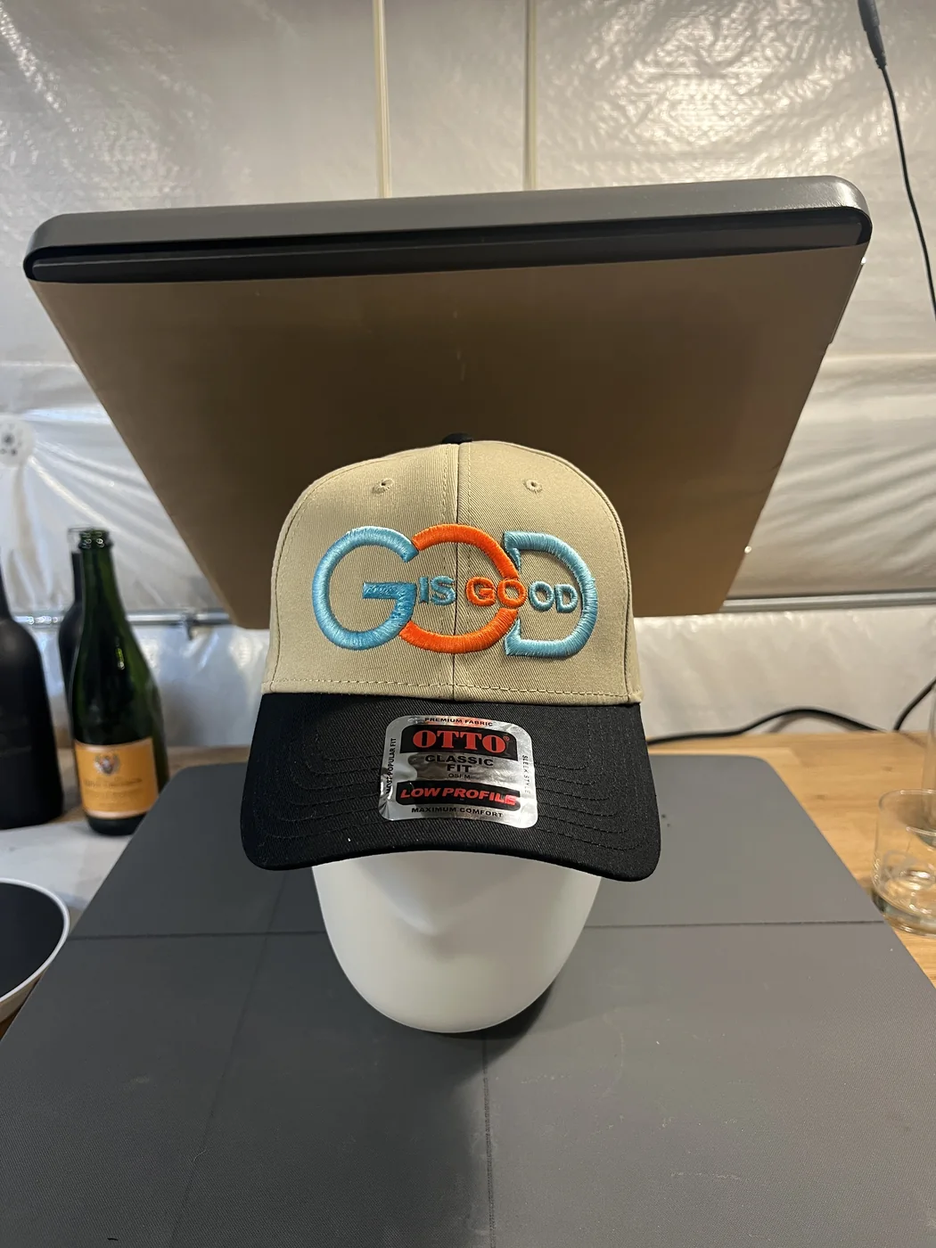 Two-tone baseball hat with colorful embroidered message