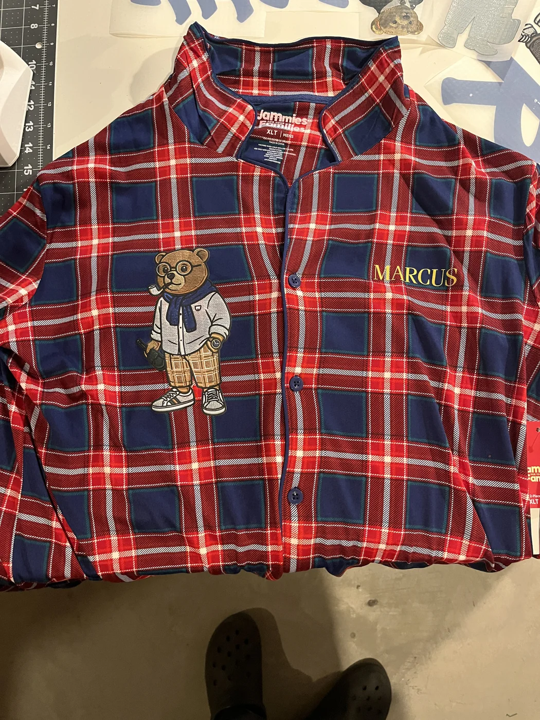 Red and navy plaid pajama shirt with embroidered character and name