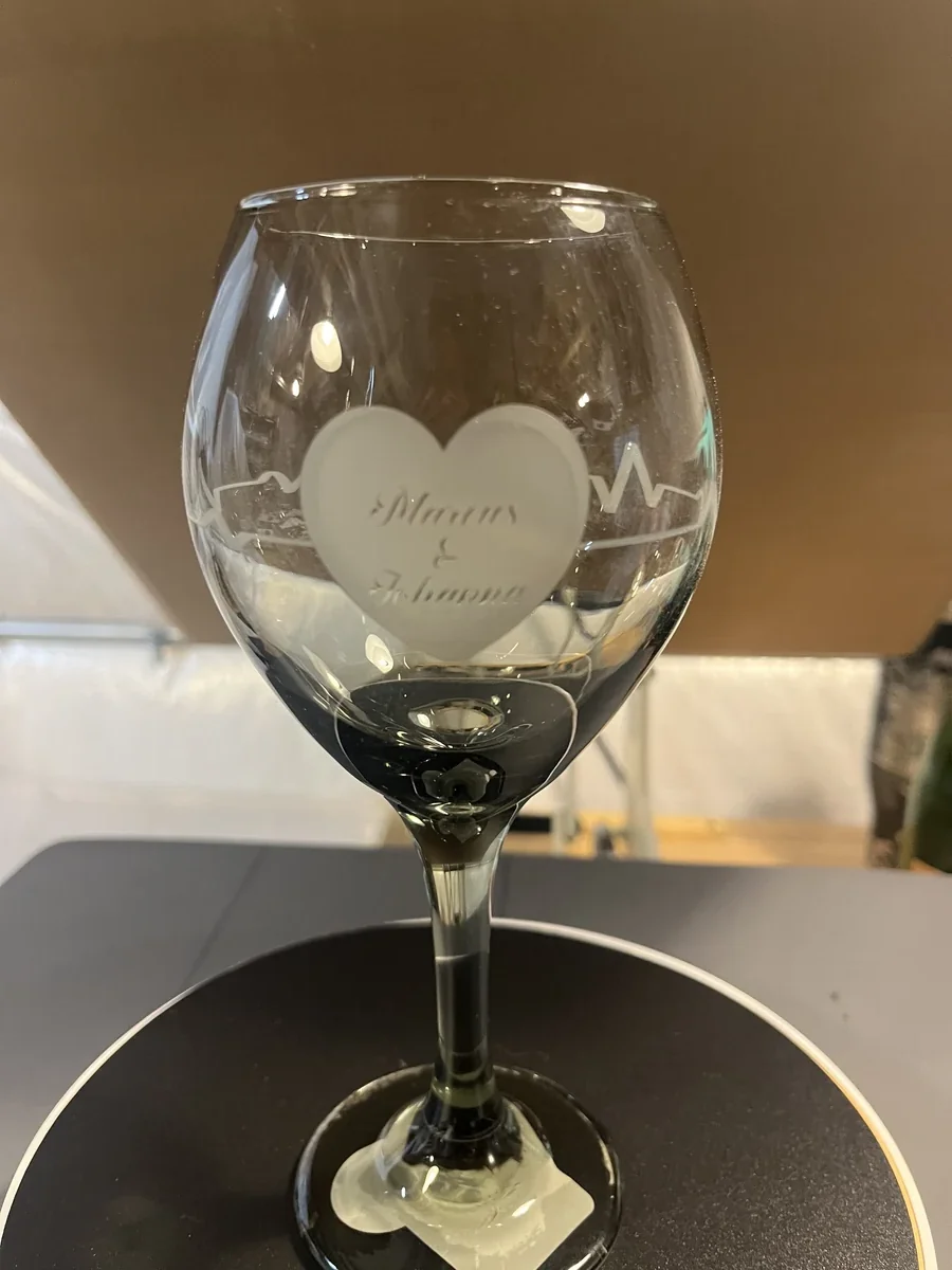 Personalized engraved wine glass with heart and heartbeat design
